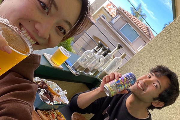 Pizza Port Brewing_Beer with cups and Pizza men and women_image 2