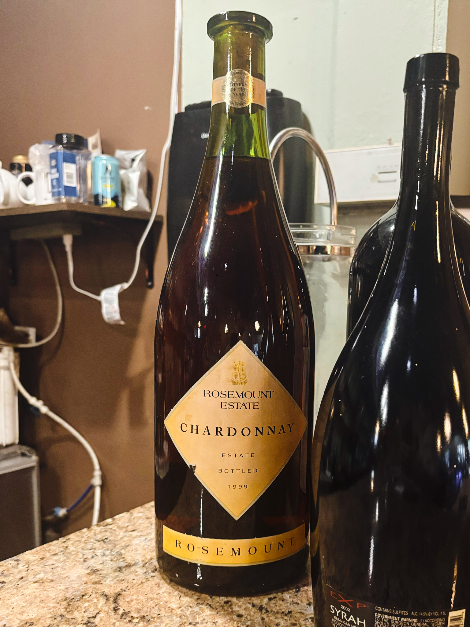 Close-up of a Rosemount Estate Chardonnay wine bottle displayed on a countertop inside Industry Cafe and Jazz